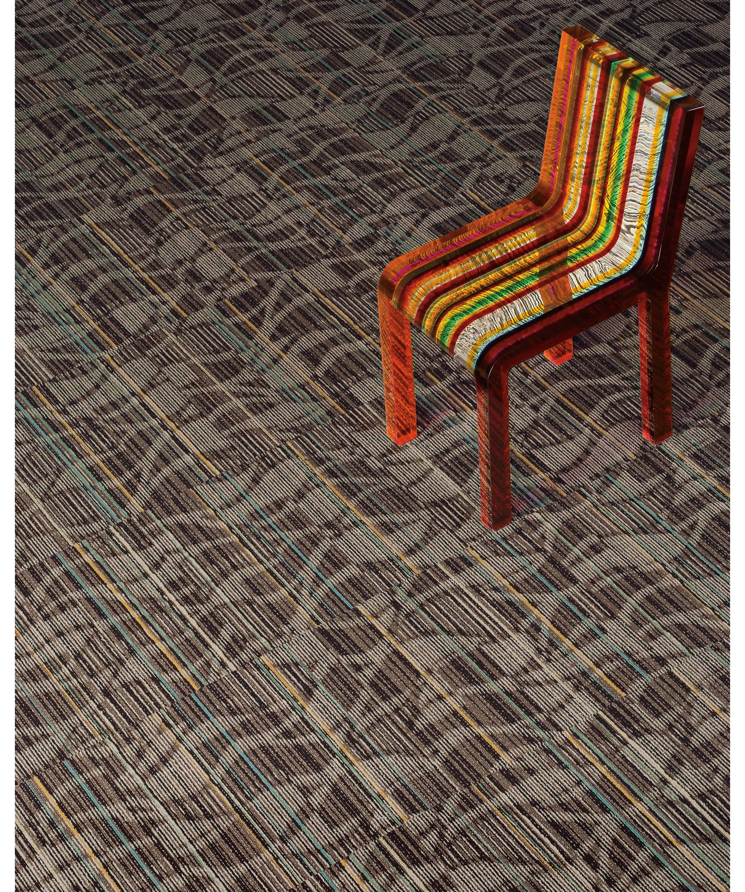 Interface Miramar Colores carpet tile in heightened view with multicolored chair image number 3